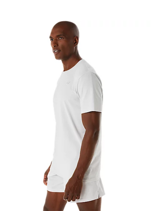 Side view of a Man wearing a glacier grey Asics t-shirt and shorts set on a white background.