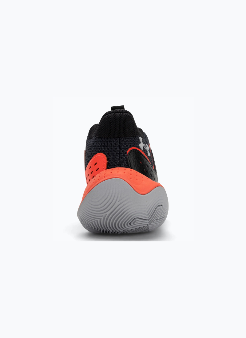 Back view of a pair of Black and orange Under Armour Under Armour GS Jet '23 Kids sneaker on a white background