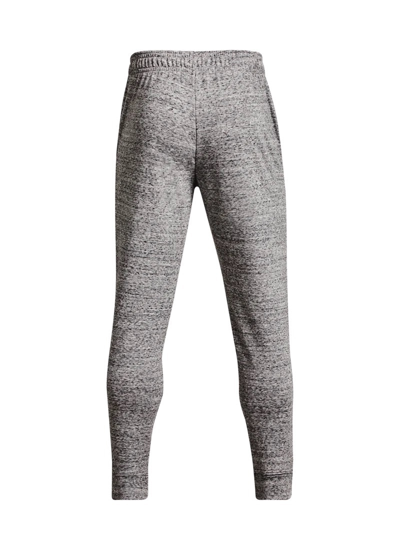 Back view of Gray jogger pants with Under Armour logo on a white background