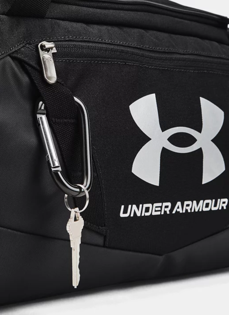 Black Under Armour bag with a carabiner and keys attached on a white background
