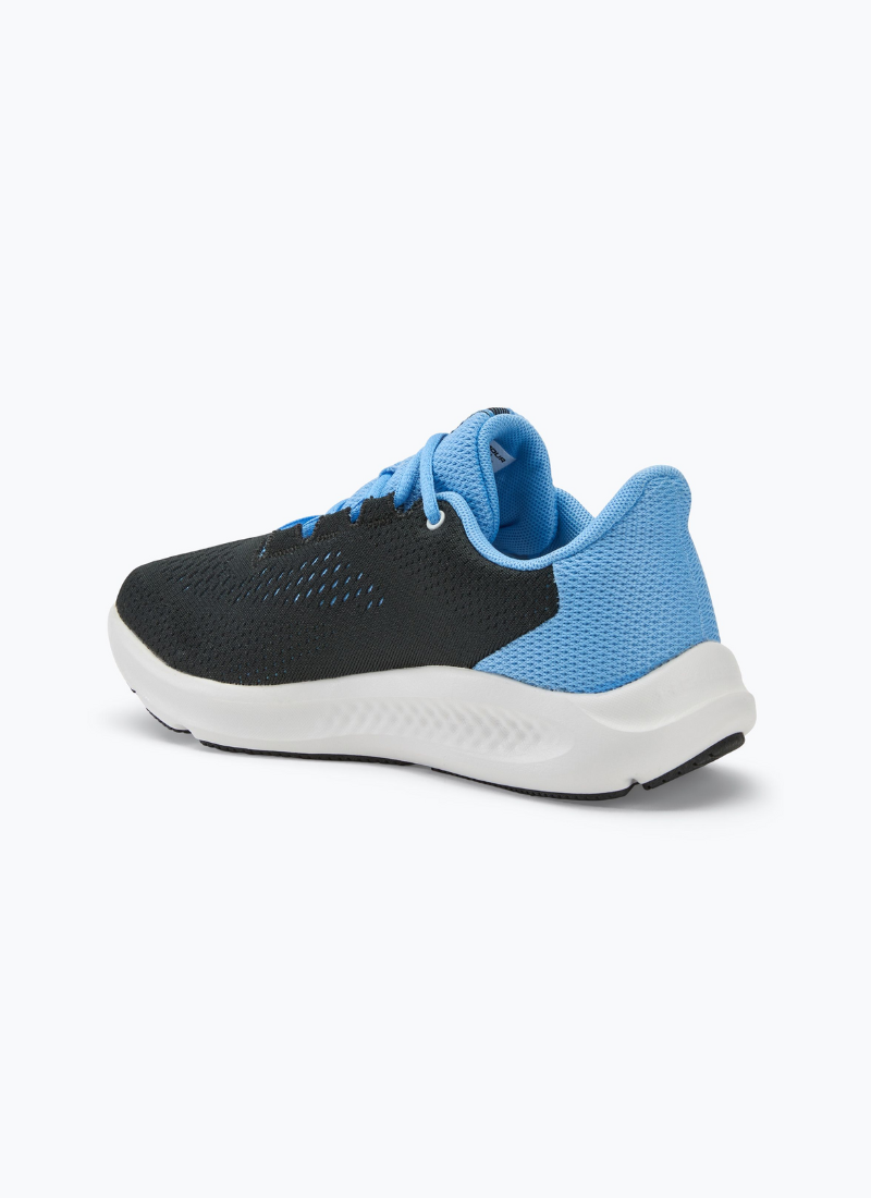 Back view of a pair of Under Armour Women's Charged Pursuit 3 in black and blue against a white background