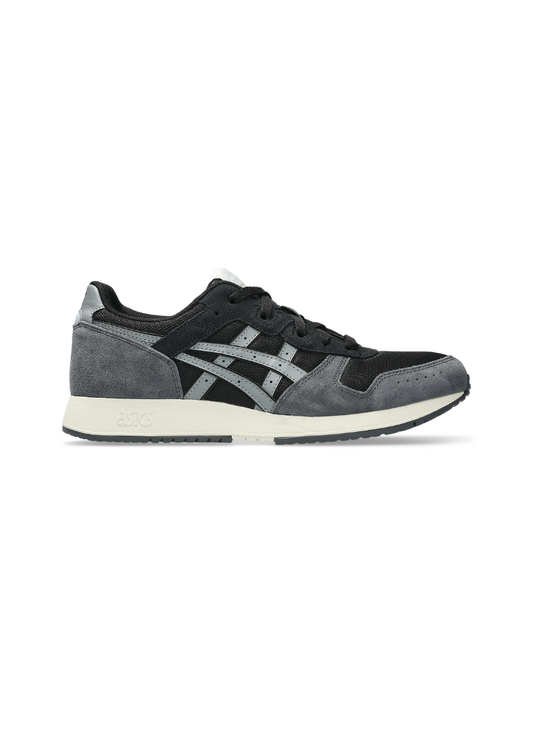 Medial side profile view of the Asics Lyte Classic Sneaker showcasing the inner dark mesh construction, grey suede heel counter, and debossed Asics logo on the heel midsole.