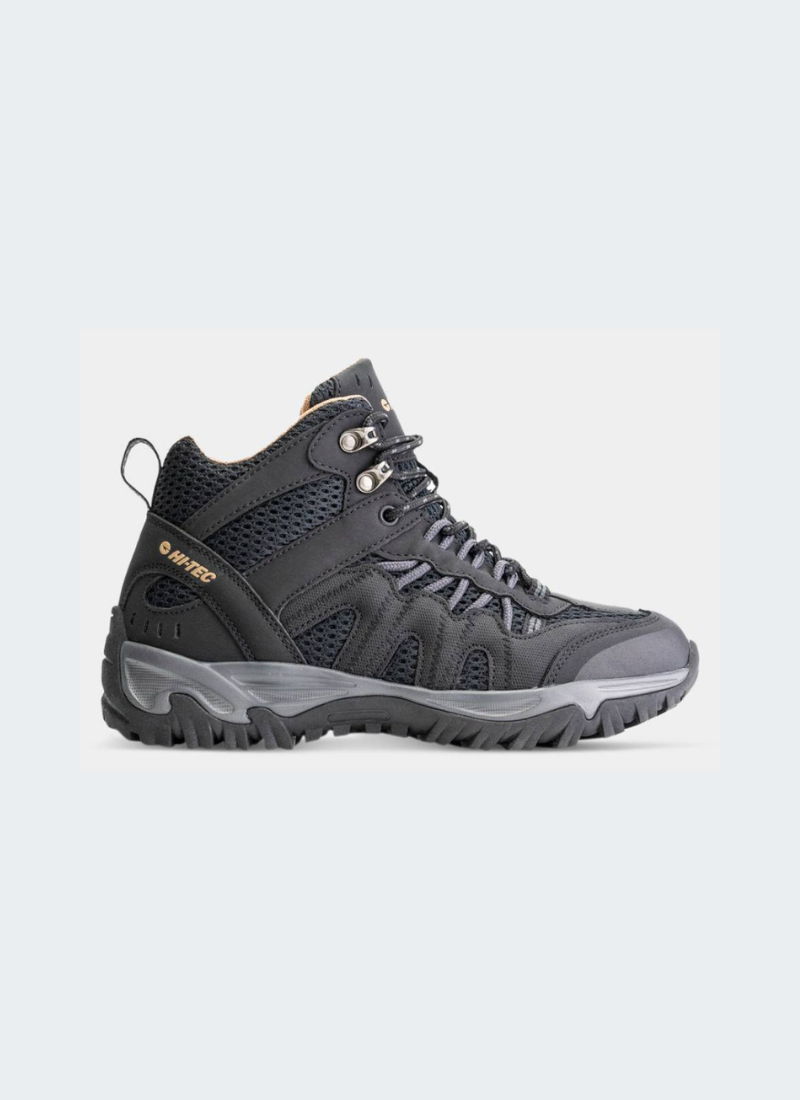 Black women's hiking boot on a light gray background
