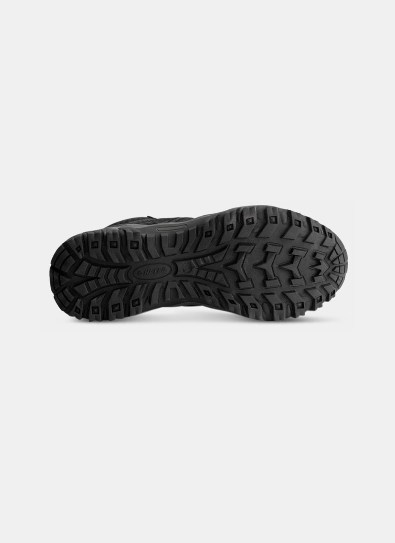 Black hiking boot sole on a white background