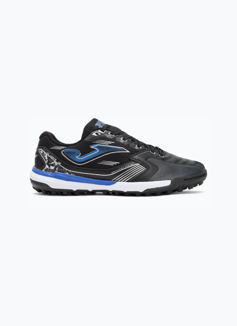 Joma Liga 5 men's turf football boots side view showing black synthetic upper, royal blue Joma logo, ventilation system detail, royal blue midsole, and multi-stud outsole