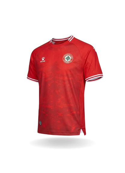 Front view of the red Kelme Lebanon National Team home jersey featuring white collar trim and the circular team crest on the chest.