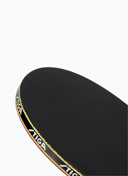 Close-up of STIGA Hobby Clash table tennis racket blade top showing black rubber surface and branded edge tape detail