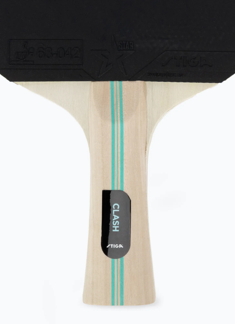 Close-up of STIGA Hobby Clash table tennis racket handle showing CLASH model label, teal stripe detail, and ITTF rubber approval stamp