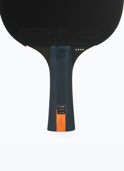 Close-up of STIGA Vision 4-Star table tennis racket handle showing VISION model label, four-star rating, and orange stripe detail on dark concave grip