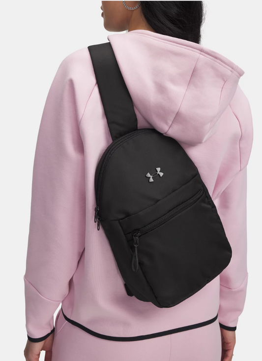 Person wearing a pink hoodie with a black Under Armour backpack.