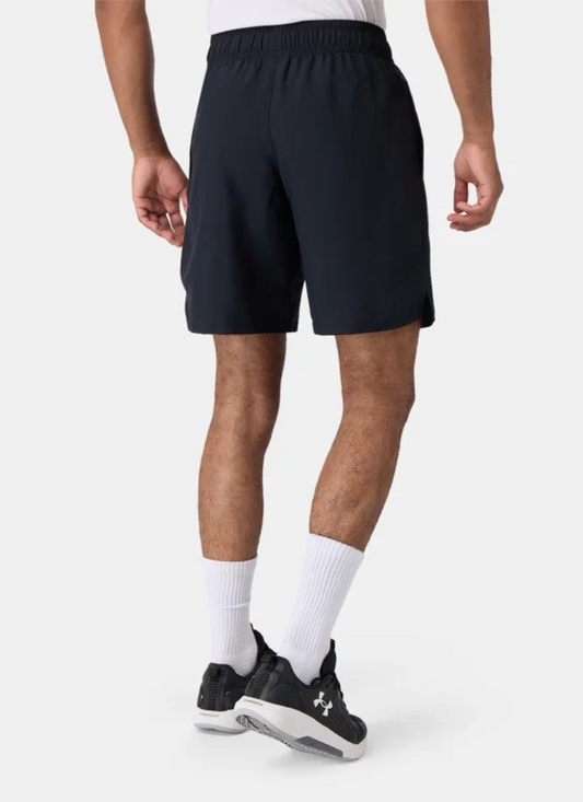 Back view of a Person wearing black athletic shorts on a white background