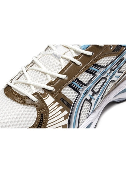 Close-up of Asics Gel-Kayano 12.1 Cream/Stillwater forefoot, detailing mesh upper, olive overlays, and light blue trim stitching.