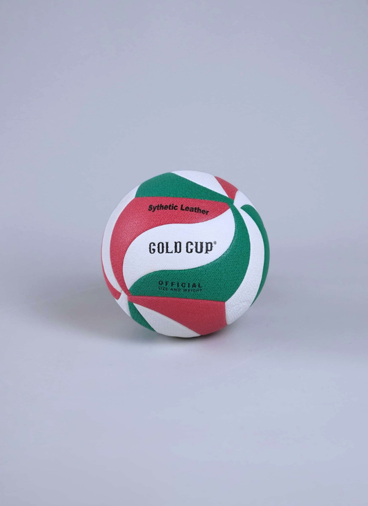 A synthetic leather volleyball with green, red, and white panels, featuring the text 'GOLD CUP OFFICIAL' and 'Synthetic Leather' on a light gray background.
