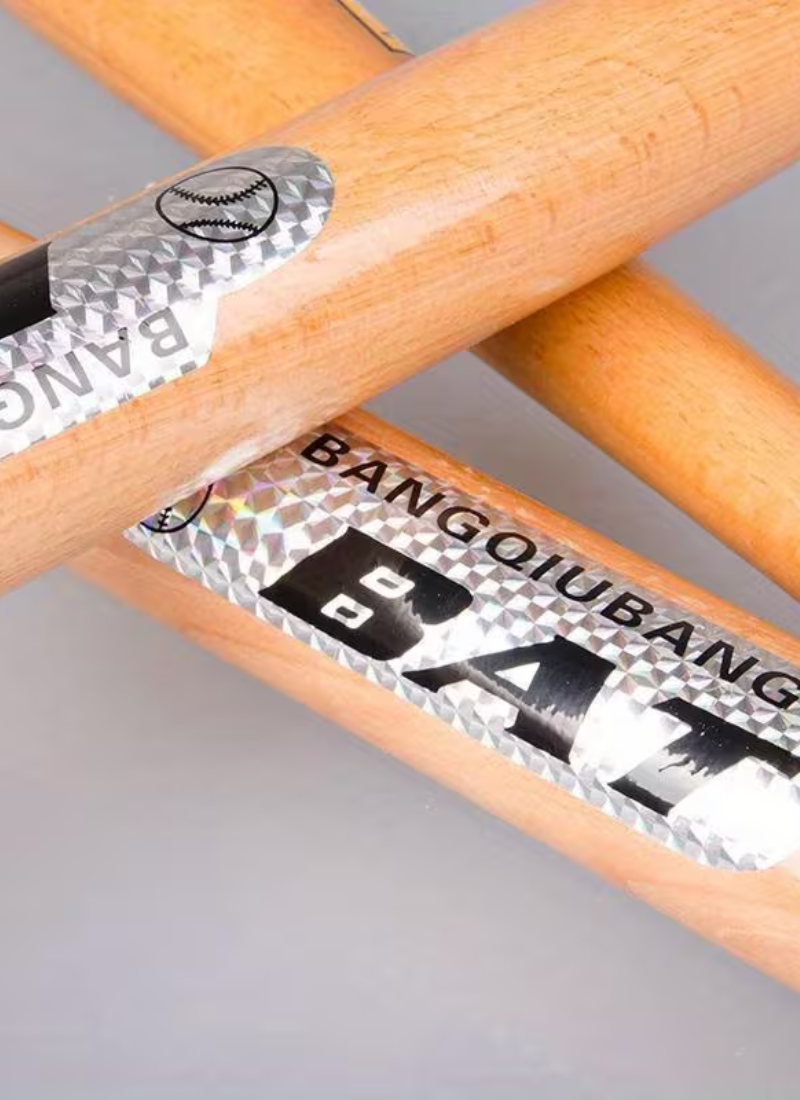 Close-up of Bangqiubang BAT label on natural hardwood baseball bat barrel